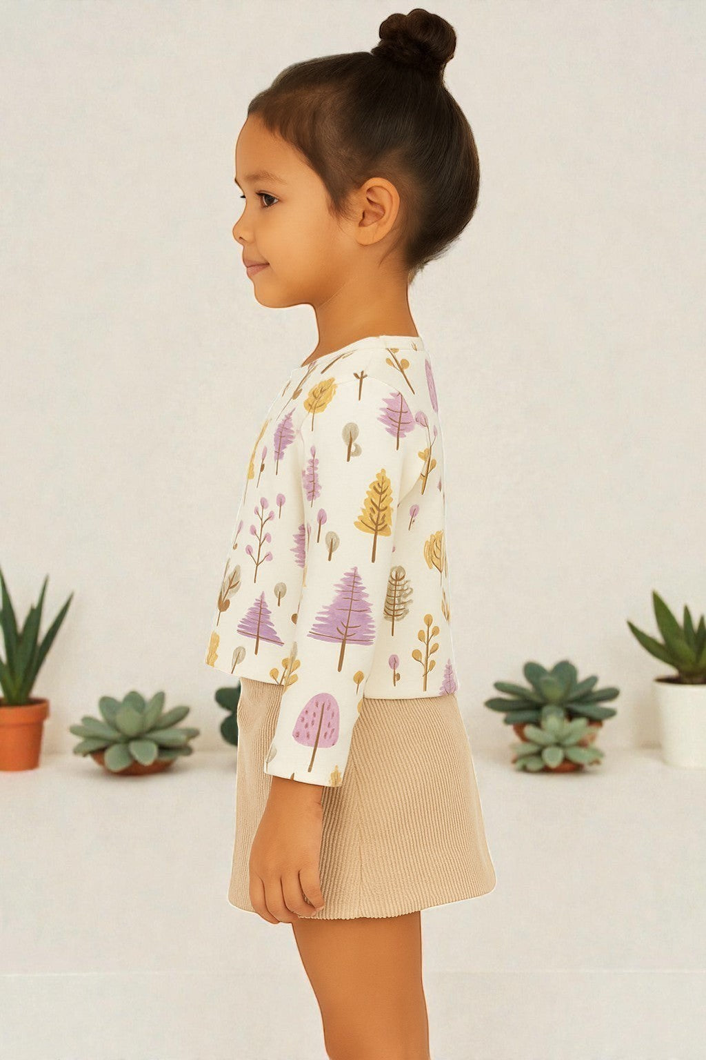 Horcun Clothing Brand cream cotton top with long sleeves and a playful all-over print of purple, yellow, and pink trees.
