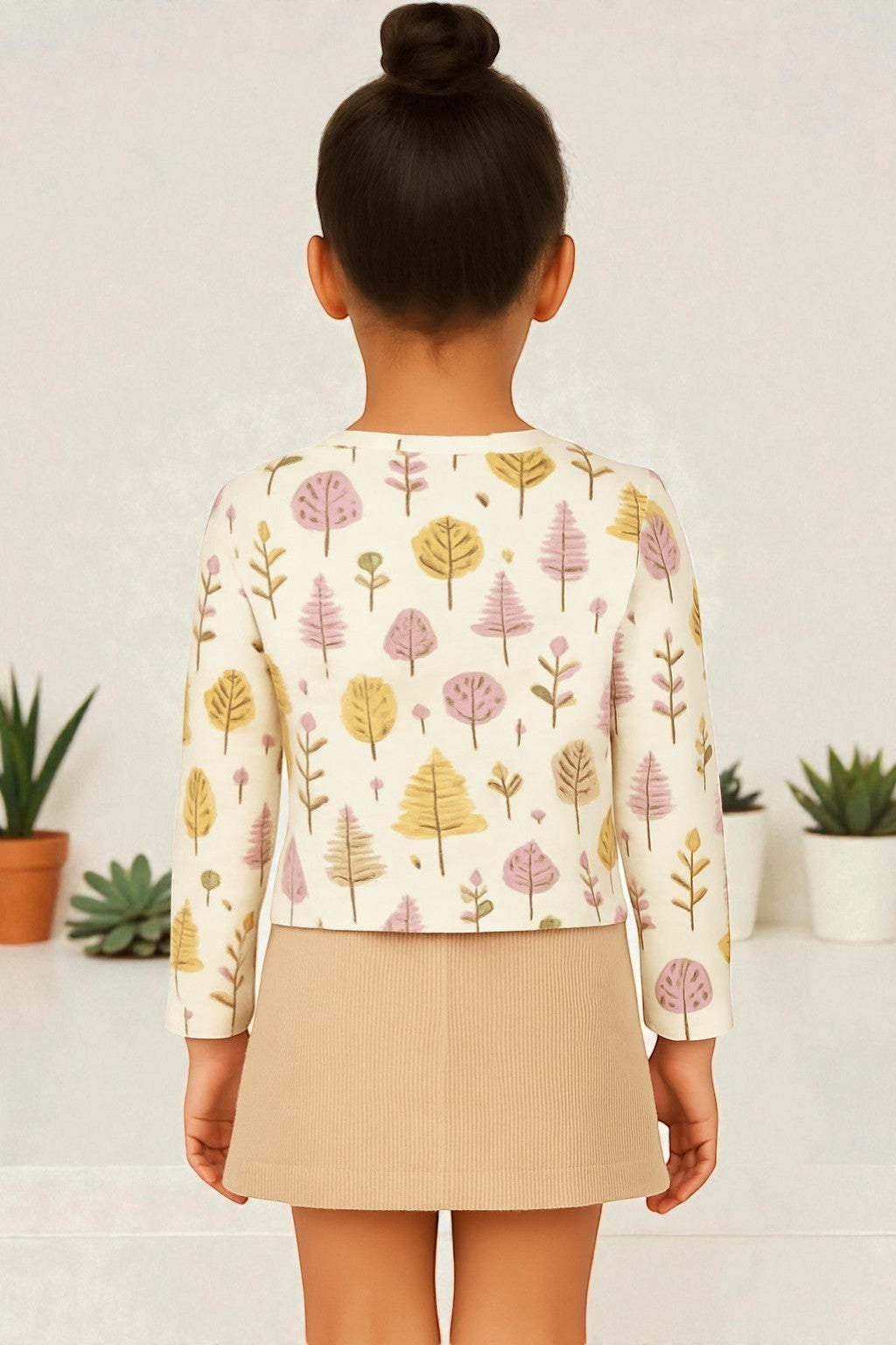 Horcun Clothing Brand cream cotton top with all-over purple, yellow, and pink tree print. Long sleeves.