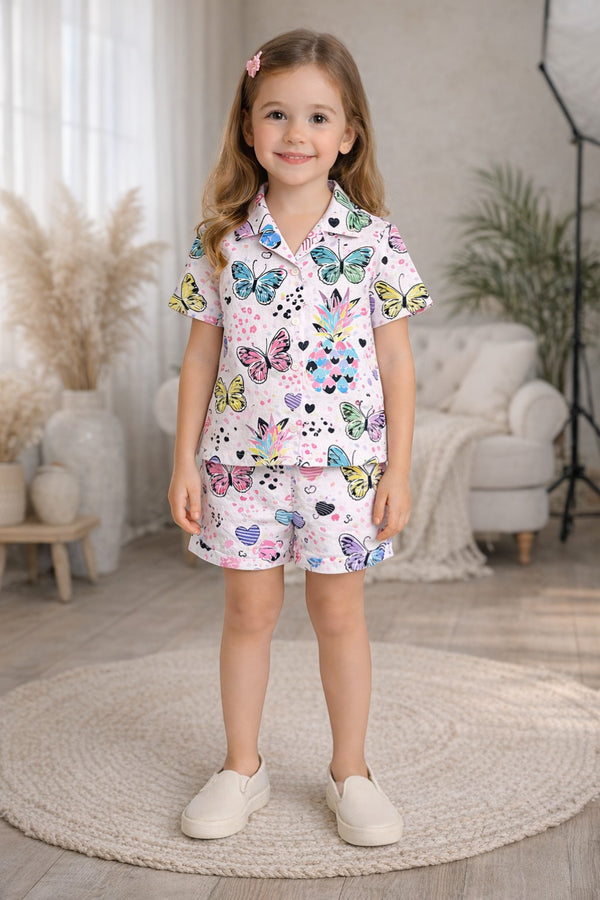 Horcun Clothing Brand girls' pink pajama set with short sleeves and shorts, featuring a colorful butterfly and pineapple print.