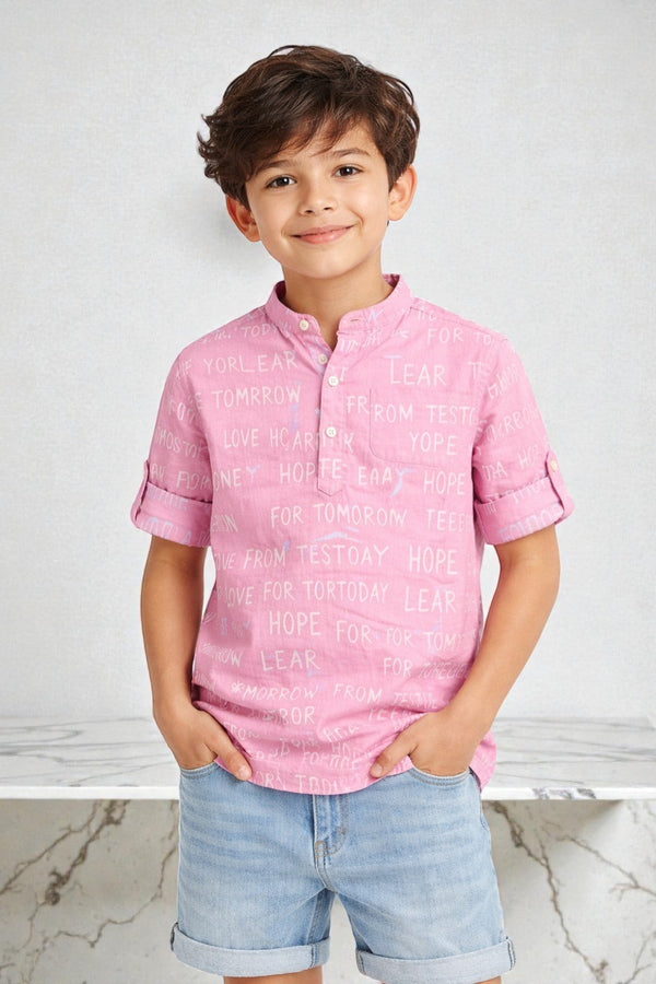 Horcun Clothing Brand pink cotton blend kurta shirt with Mandarin collar, short sleeves, and all-over uplifting word print.