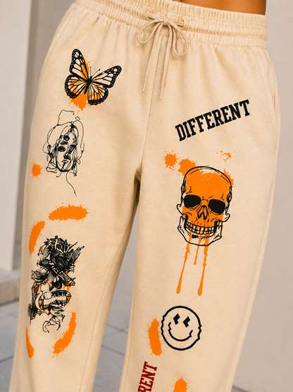 Women Beige Graphic Printed Joggers – Stylish Casual Streetwear & Lounge Pants